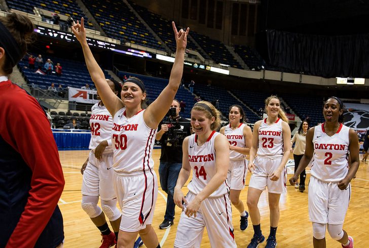 Dayton players celebrating historic tournament win