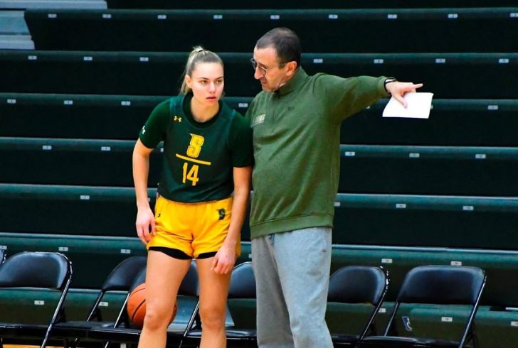 Coach guiding players during practice session