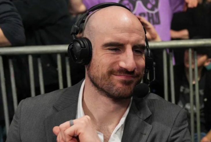 Matthew Rehwoldt on wrestling commentary desk